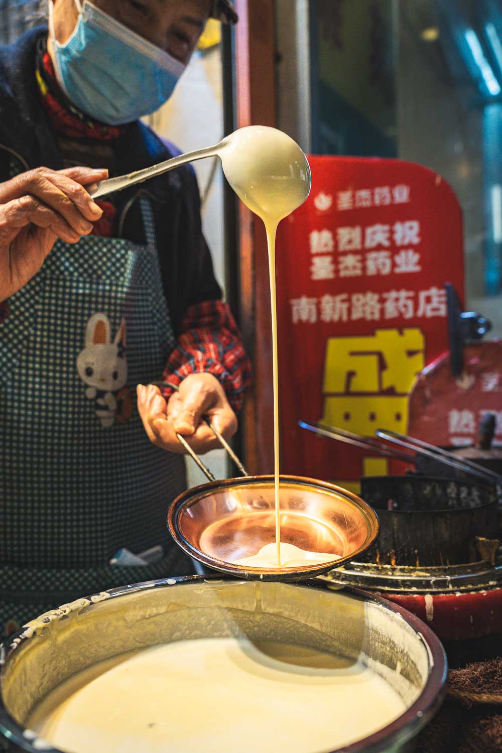 Chengdu pancakes batter poured into a pan