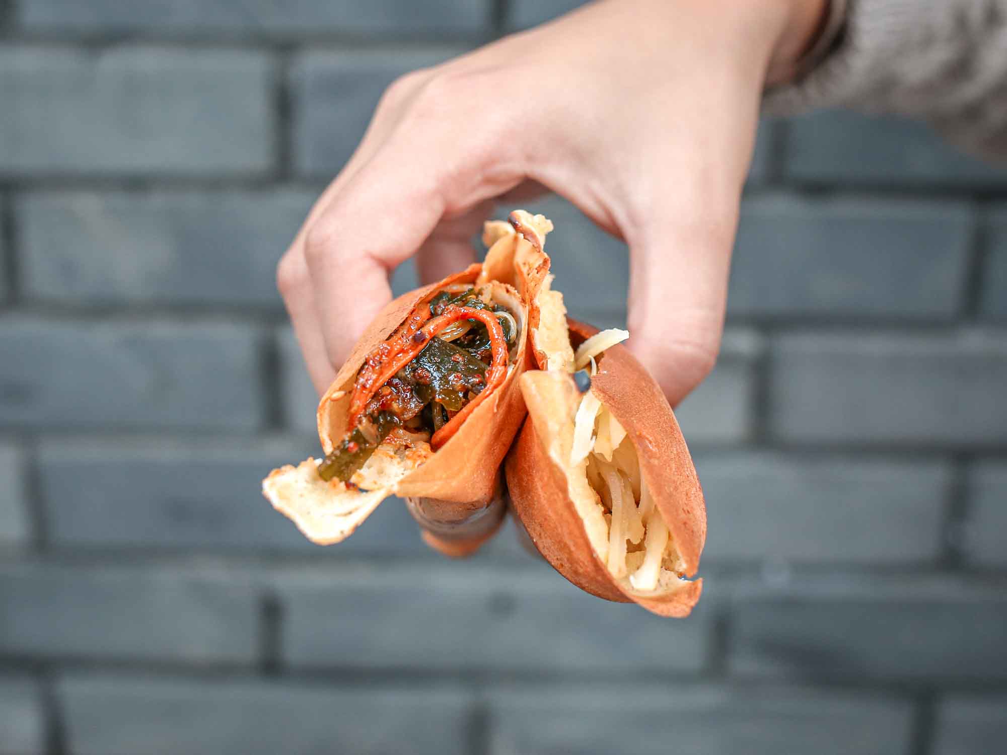 Hand holding Chengdu egg baked pancakes