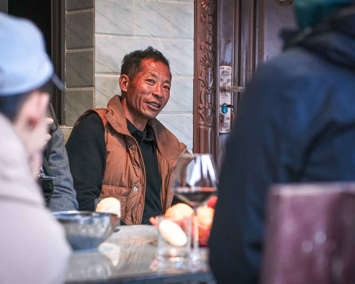 HongXing Talking To Guests at Table