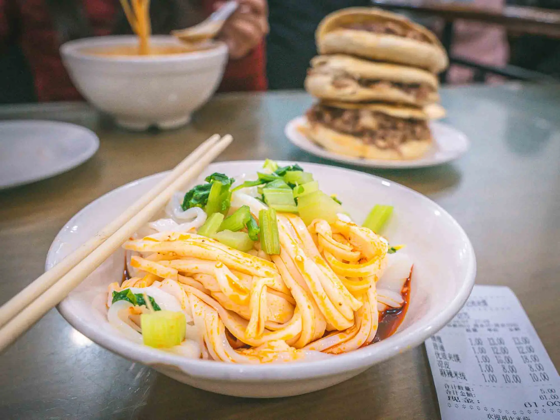 Bowl of noodles with chopsticks