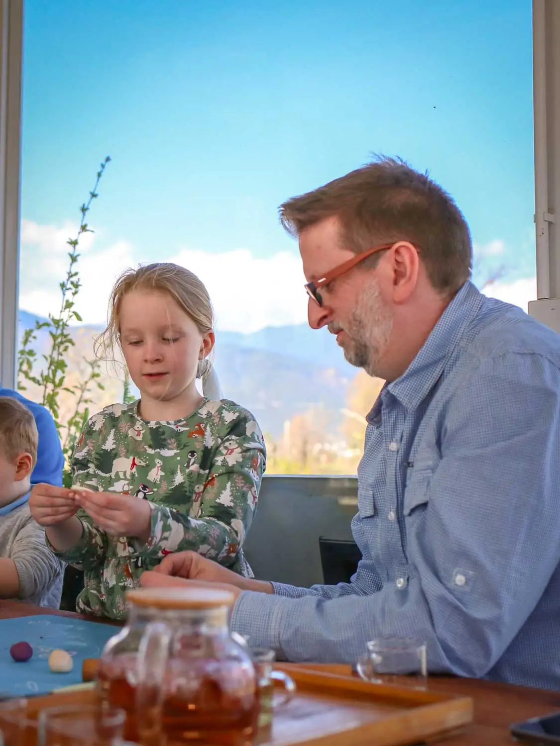 Father and daughter making rose cakes